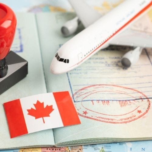 Approved stamp beside Canadian immigration documents